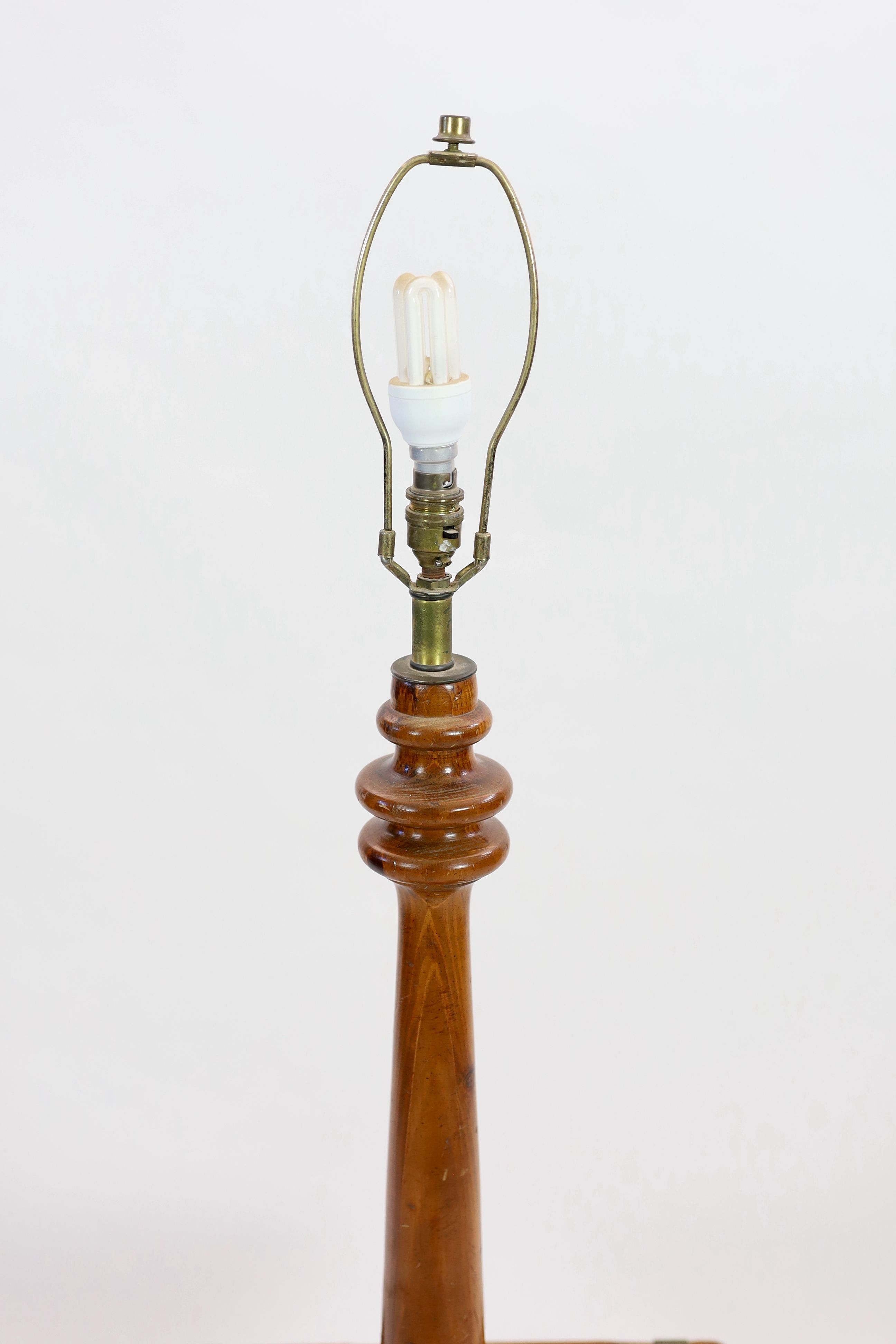 A pine and walnut standard lamp, with square mid tier, height 118cm